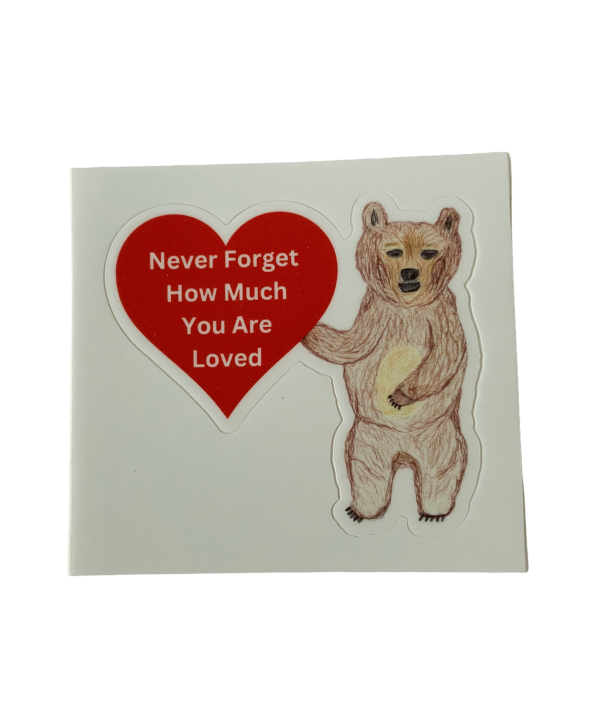 Never Forget How Much You Are Loved sticker featuring JJ Bear holding a red heart.